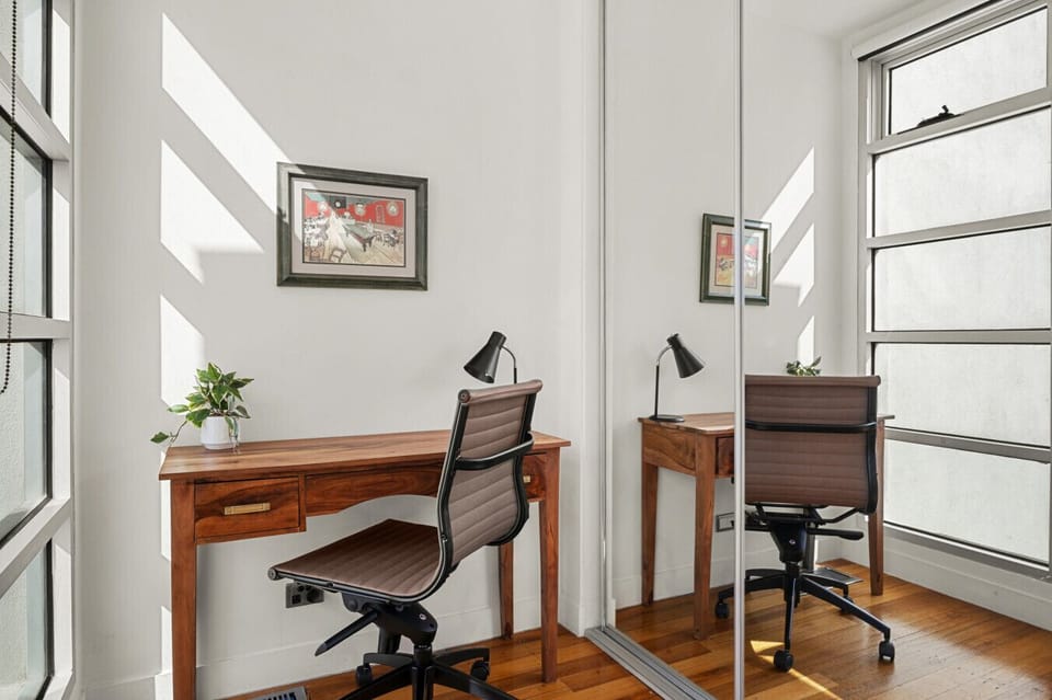 Work from home at this study nook that has a monitor you can link up to your laptop