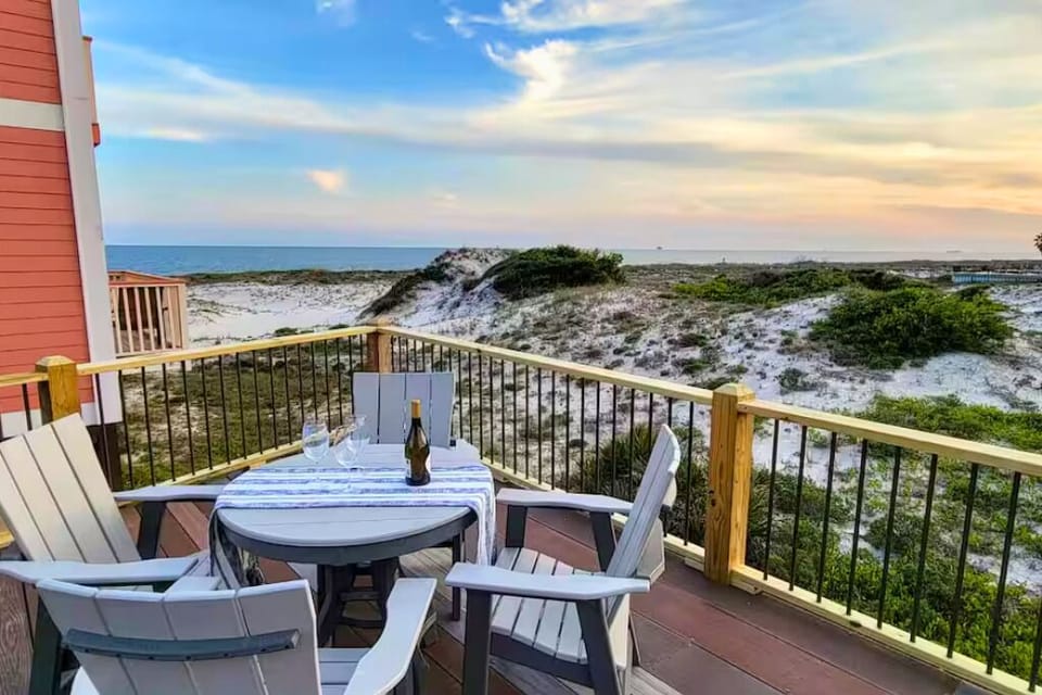 Sweeping beach and sunset views away you. Just one home back from beachfront.