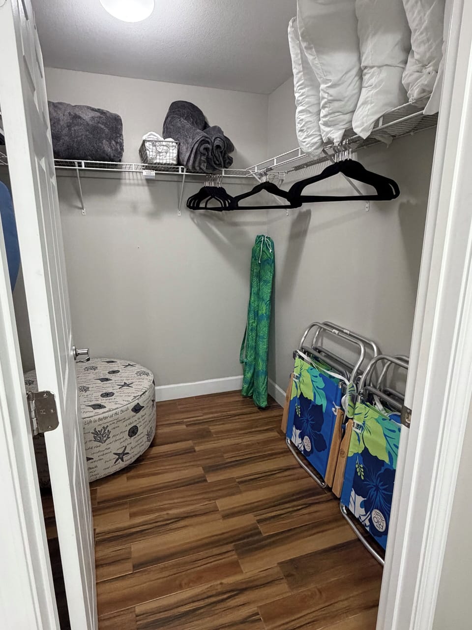 Primary bedroom closet , comes with 4 beach chairs and 2 beach umbrellas