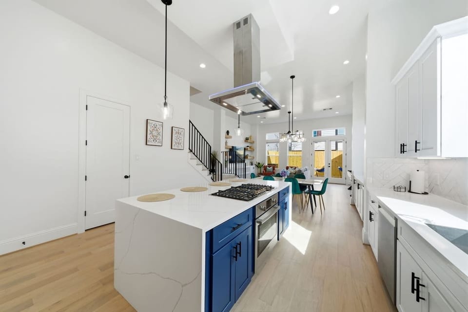Chef’s kitchen w/Bosch Appliances & stunning waterfall island w/seating for four. Equipped w/spices, cookware, blender, coffeemaker, kettle, dishes, air fryer, silverware & more—perfect for cooking and entertaining. Plus fridge makes cocktail ice. 