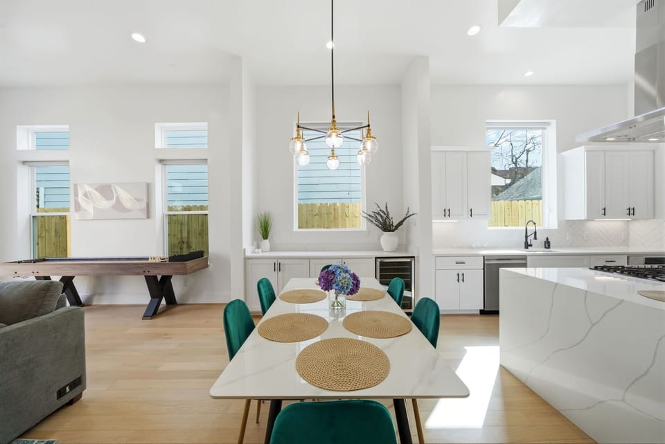 Stylish dining space w/seating for six plus four additional seats at the island.