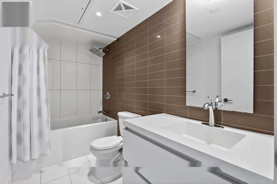 Family Suite, Lake View | Bathroom | Combined shower/tub, free toiletries, hair dryer, towels