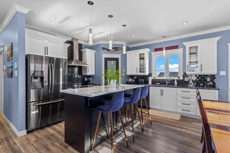 Open-concept kitchen and dining area with lots of natural light.