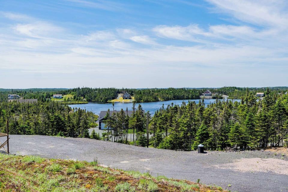 Stunning pond and forest landscape surrounding the cabin.