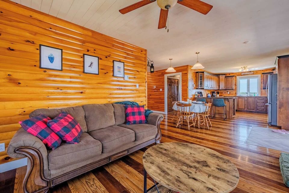 Relaxing lounge area with plush seating and rustic wood interior.