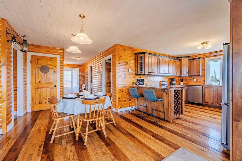 Open-concept dining and kitchen area for easy group gatherings.