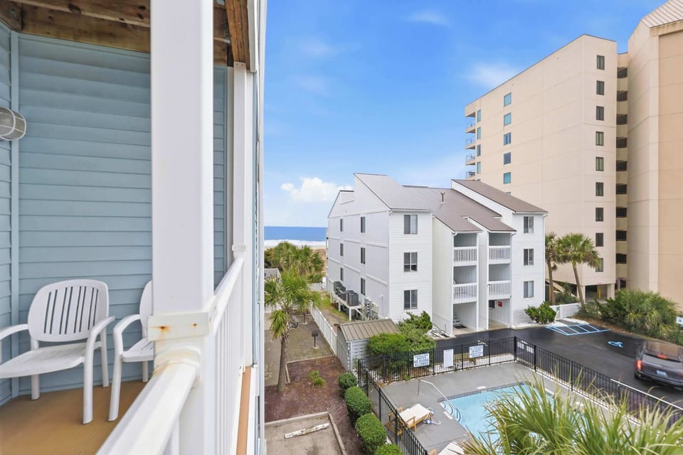 View from balcony of neighboring property pool and beach. That pool does not belong to our property.