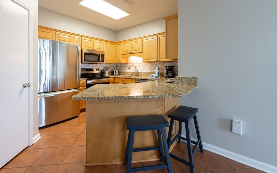 Condo, 2 Bedrooms | Private kitchen | Fridge, oven, coffee/tea maker