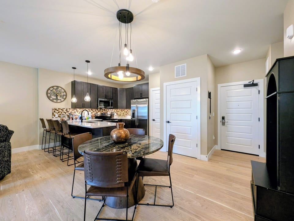 Your open-concept kitchen flows seamlessly into the dining area, featuring sleek granite counters and modern pendant lighting for memorable meals.