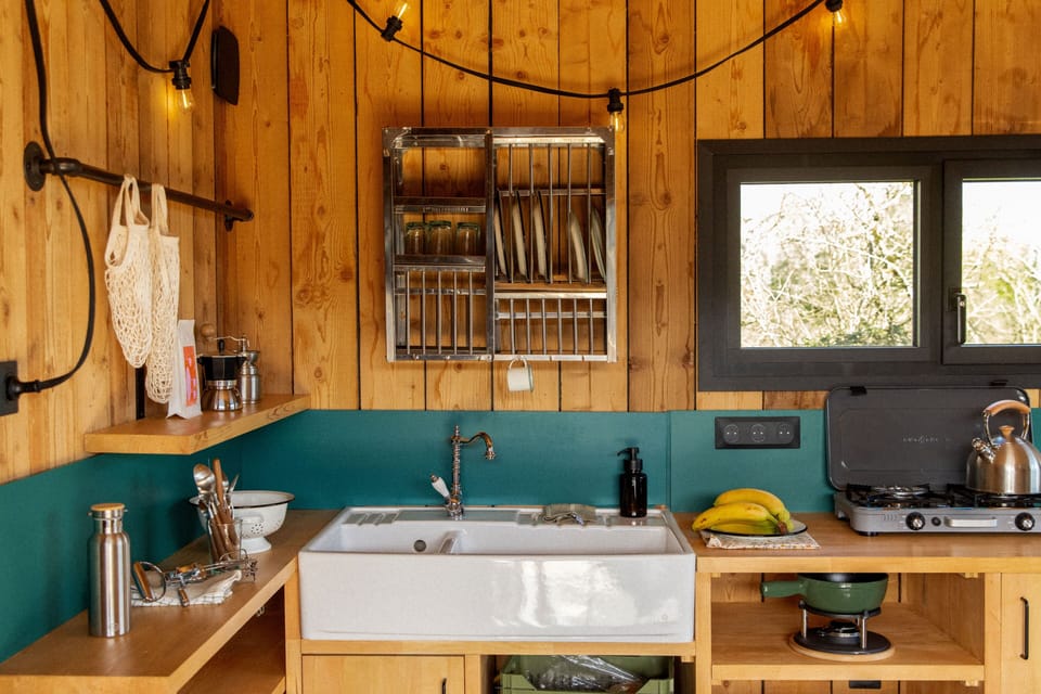 Mini-fridge, stovetop, cookware/dishes/utensils