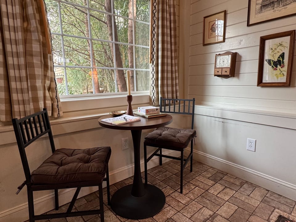 A cozy window nook perfect for morning coffee, quiet conversation, or planning the day’s adventures.