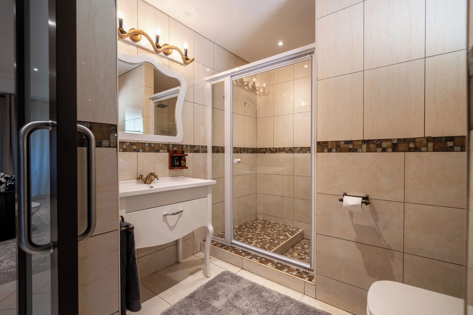 Luxury Double Room, Patio, River View | Bathroom | Shower, hair dryer, slippers, towels