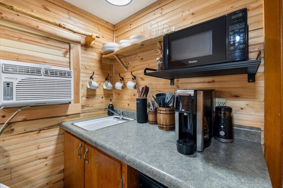 Whip up meals with ease in a fully equipped cabin kitchen with a convenient sink.
