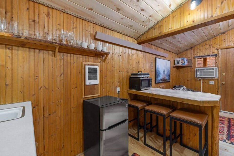 Stylish kitchen space with bar seating, making it easy to prep meals and enjoy casual gatherings.