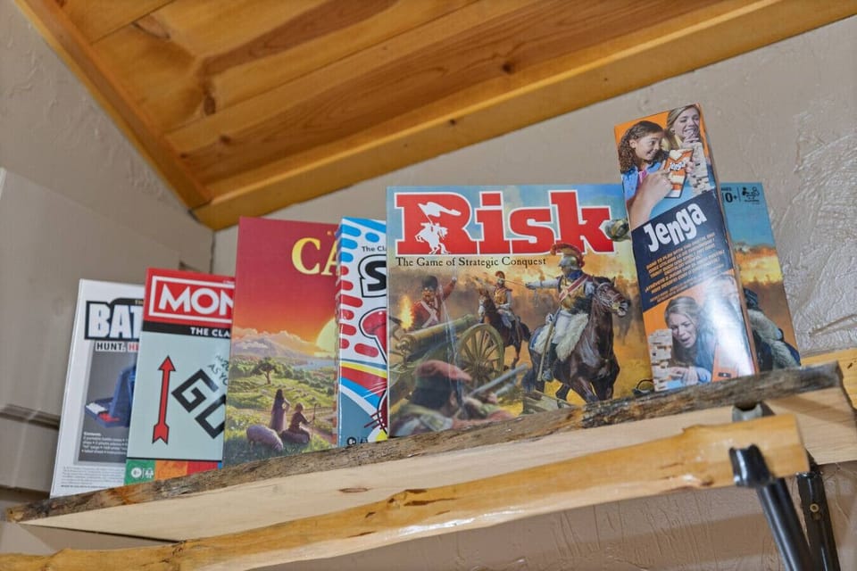 Board games provided for cozy nights inside the cabin, perfect for couples or small groups.