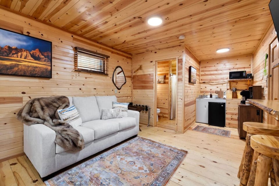 Cozy lounge and kitchenette setup at Black Hills Bungalows, perfect for easy meals between adventures to Custer State Park, Mount Rushmore, and Rapid City.