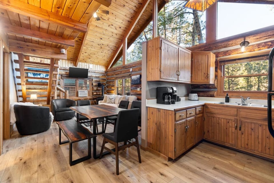 Gather for meals and game nights with a full dining area and bright, rustic kitchen.