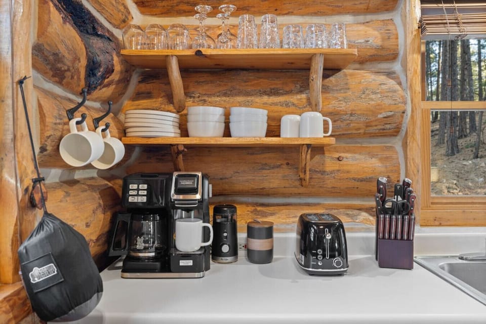 Coffee station with grinder, toaster, mugs, and cookware. Everything you need for an easy and comfortable stay in the Black Hills.