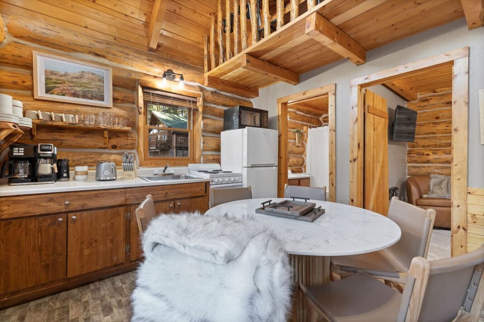 Shared meals start here—a modern, fully stocked kitchen with forest views and space to linger over coffee.