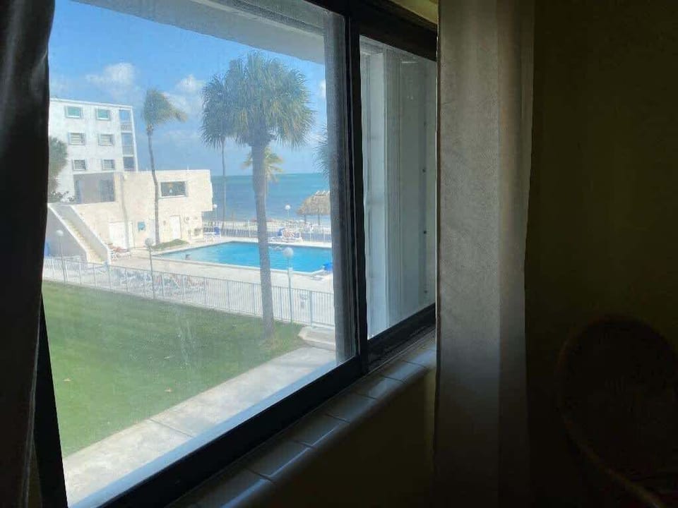 Wake up to direct pool and ocean vistas from the comfort of your sunlit bedroom.