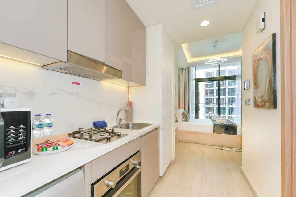 Exclusive Studio, 1 King Bed, Non Smoking, City View | Private kitchen | Fridge, microwave, oven, stovetop