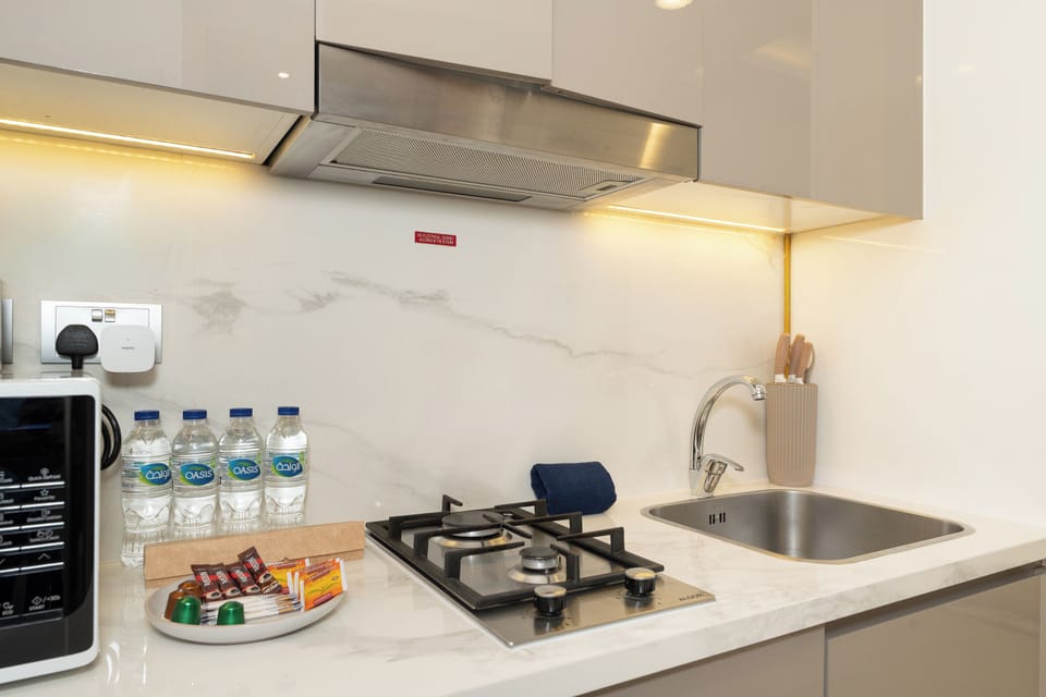 Exclusive Studio, 1 King Bed, Non Smoking, City View | Private kitchen | Fridge, microwave, oven, stovetop