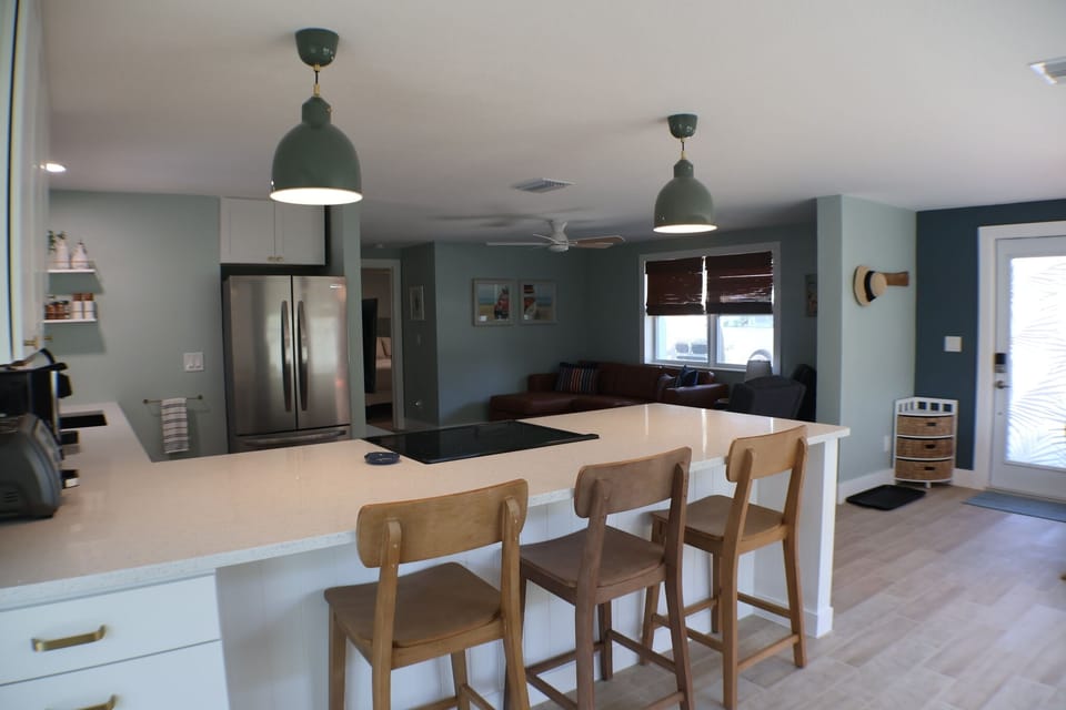 Island seating with Living Room behind