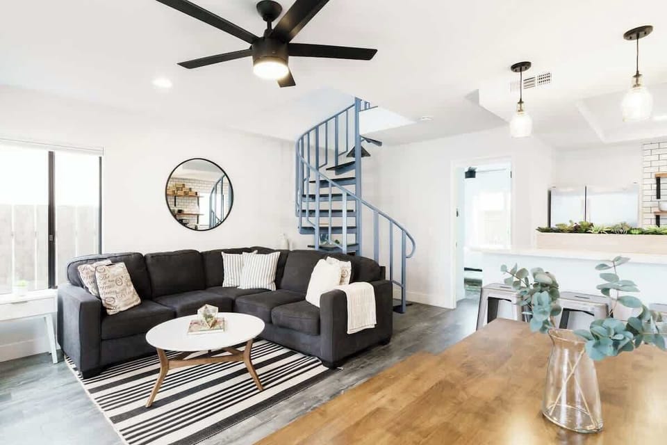 Spiral staircase leads to the two upstairs bedrooms and full bathroom upstairs