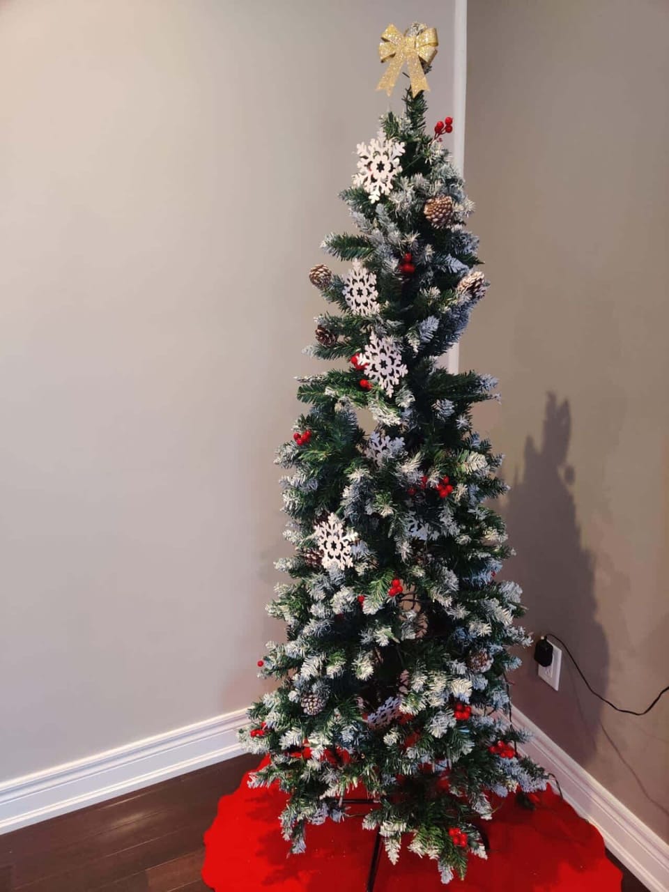 Feel the festive cheer in this cozy living room, complete with a decorated Christmas tree, warm fireplace, and inviting seating. Perfect for creating holiday memories!