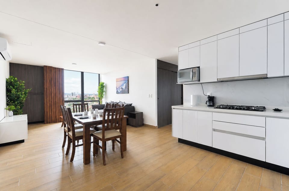 Family Suite, City View | Private kitchen | Full-size fridge, microwave, stovetop, blender