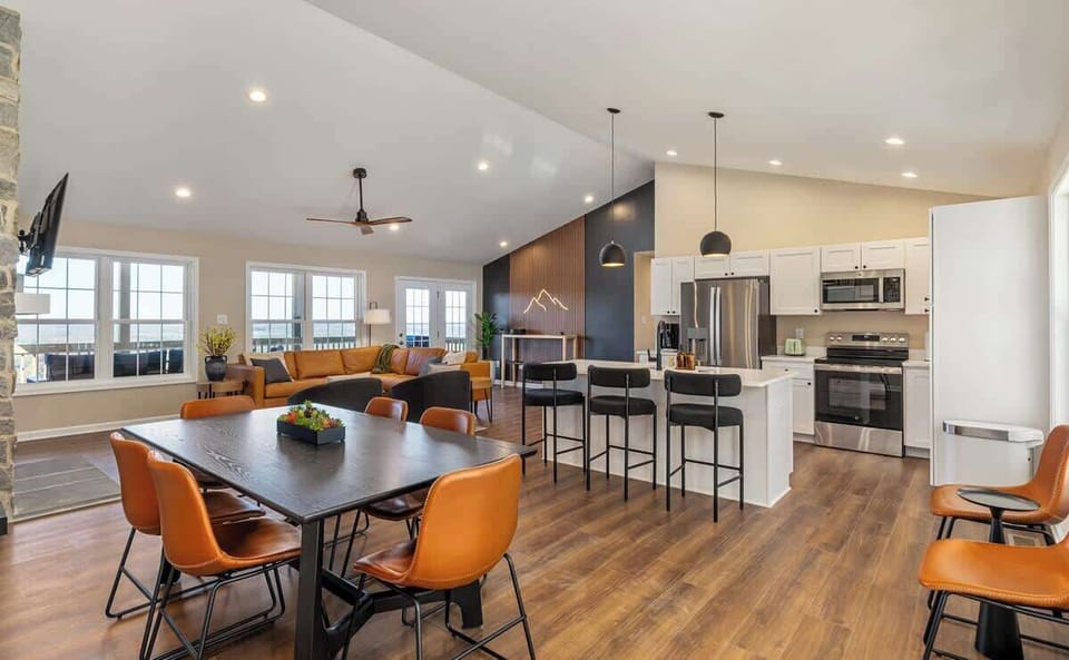 Bright open-plan with island kitchen, big windows, and chic lounge