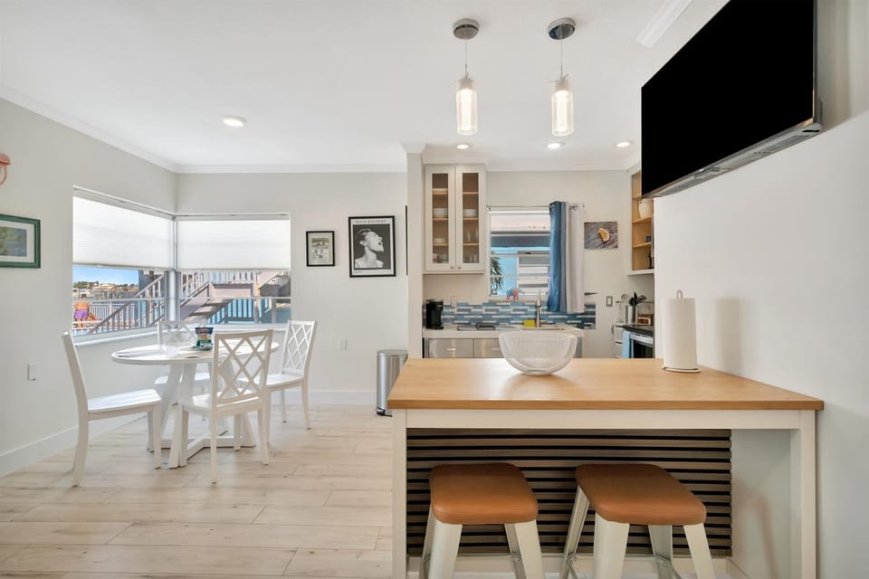 Dining setup beside the full kitchen and living room