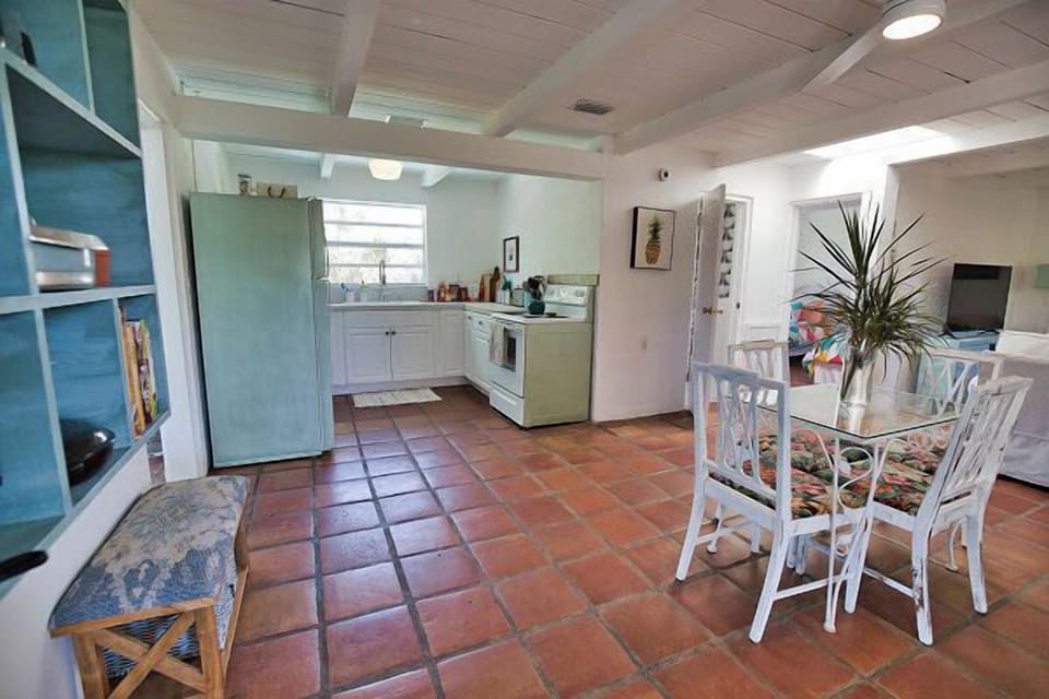 Open kitchen and dining area with rustic charm