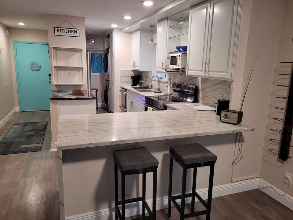 Open kitchen with breakfast bar seating
