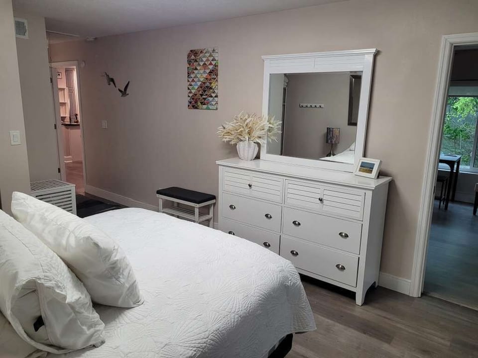 Cozy bedroom with dresser and mirror