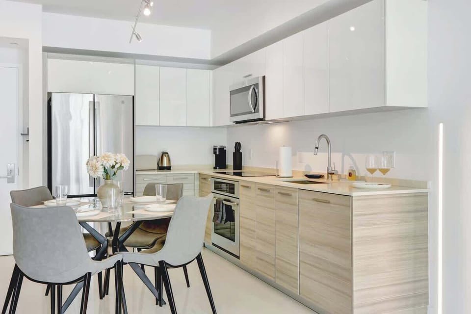 Fully stocked kitchen with modern appliances and cookware