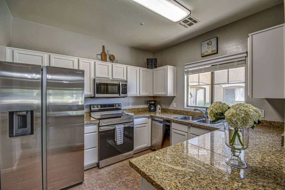 Fully equipped kitchen with modern appliances, perfect for home cooking.