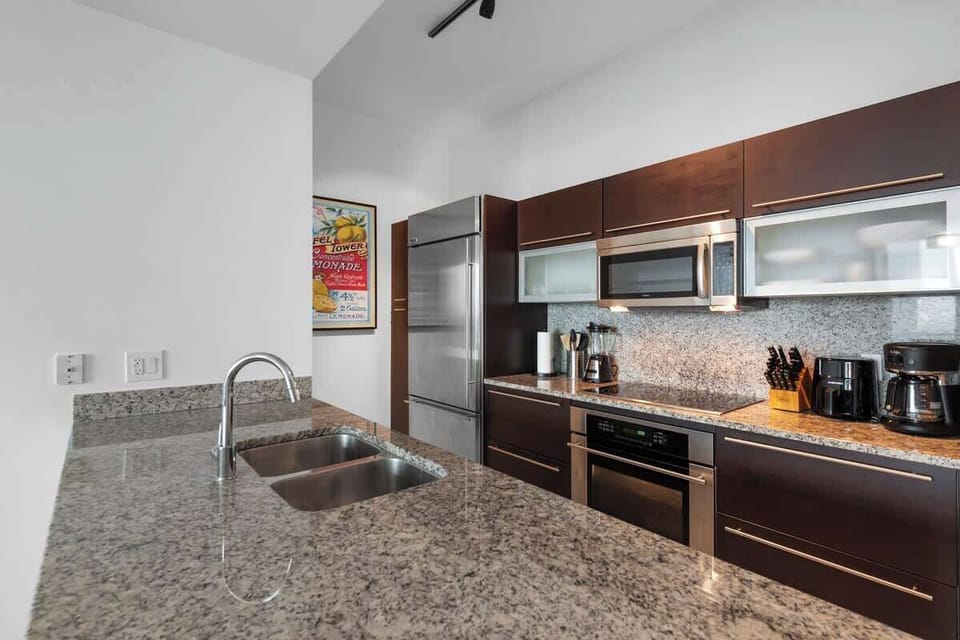 Modern kitchen fully equipped with all major appliances, cookware, and essentials for home-style meals