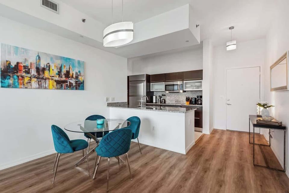 Bright dining area with comfortable seating—perfect for meals, morning coffee, or catching up on emails.