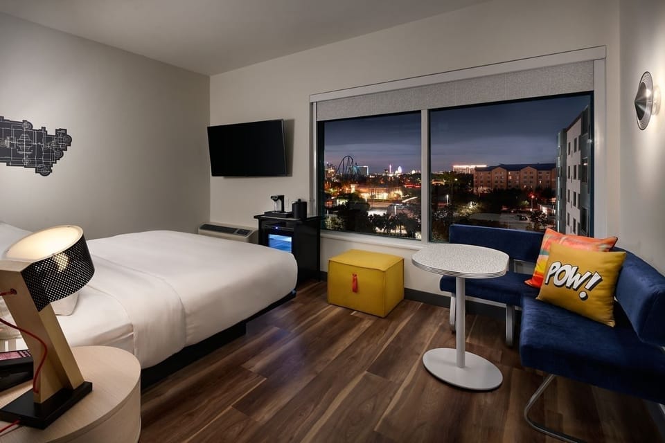 Unwind in crisp linens while city lights sparkle outside.