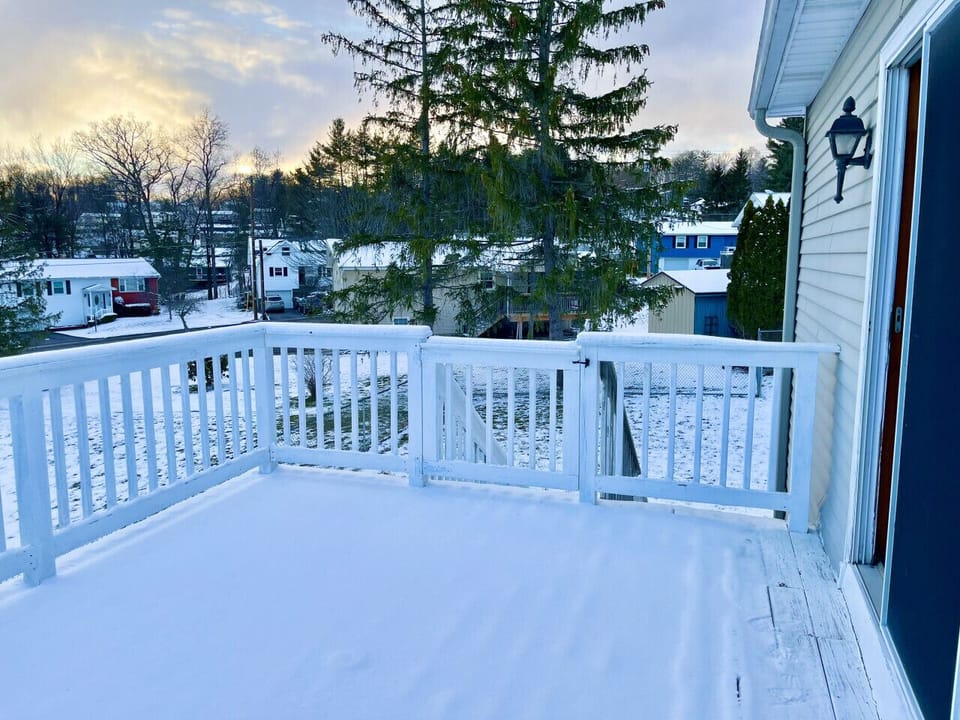 Fully fenced backyard retreat complete with an inviting deck, offering the perfect space for entertaining guests or unwinding outdoors.