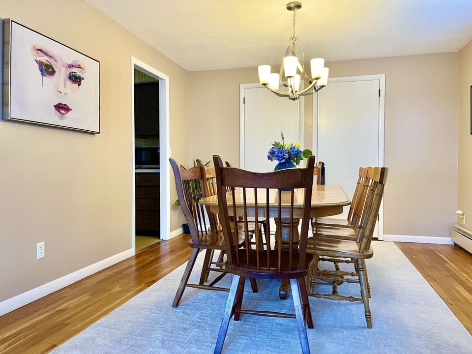 Inviting dining room with a comfortable table and seating, perfect for enjoying meals with family and friends. The open, bright space creates a warm atmosphere for both casual dining and special gatherings.