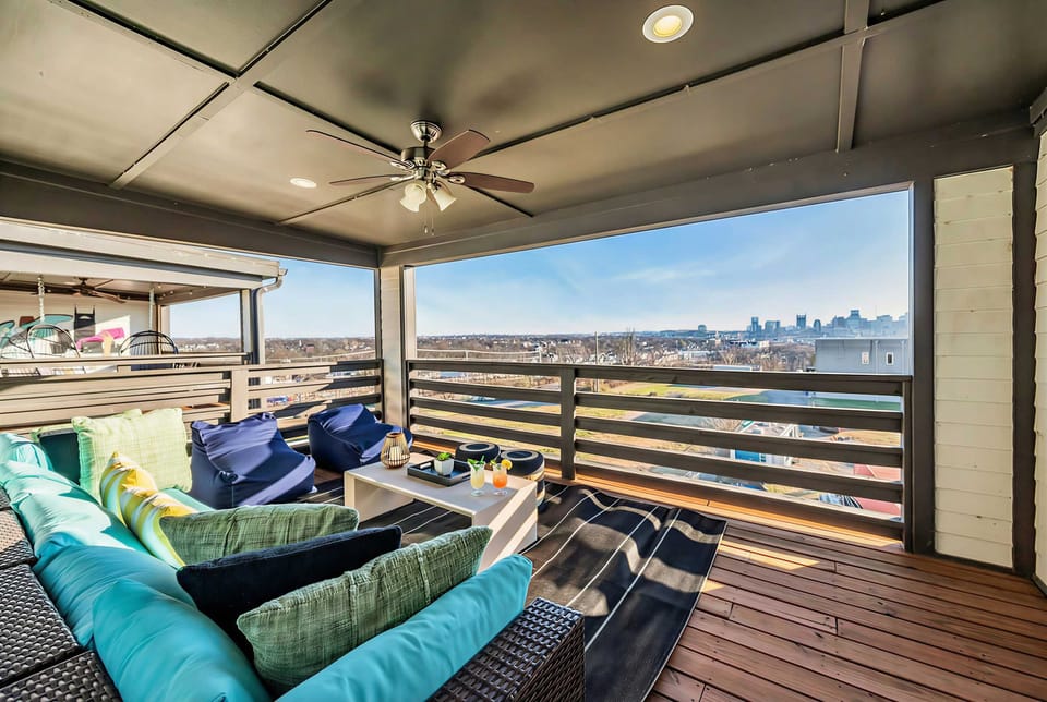 Outdoor seating on the upper-level balcony overlooks the neighborhood, a quiet spot to sip morning coffee before the day kicks off
