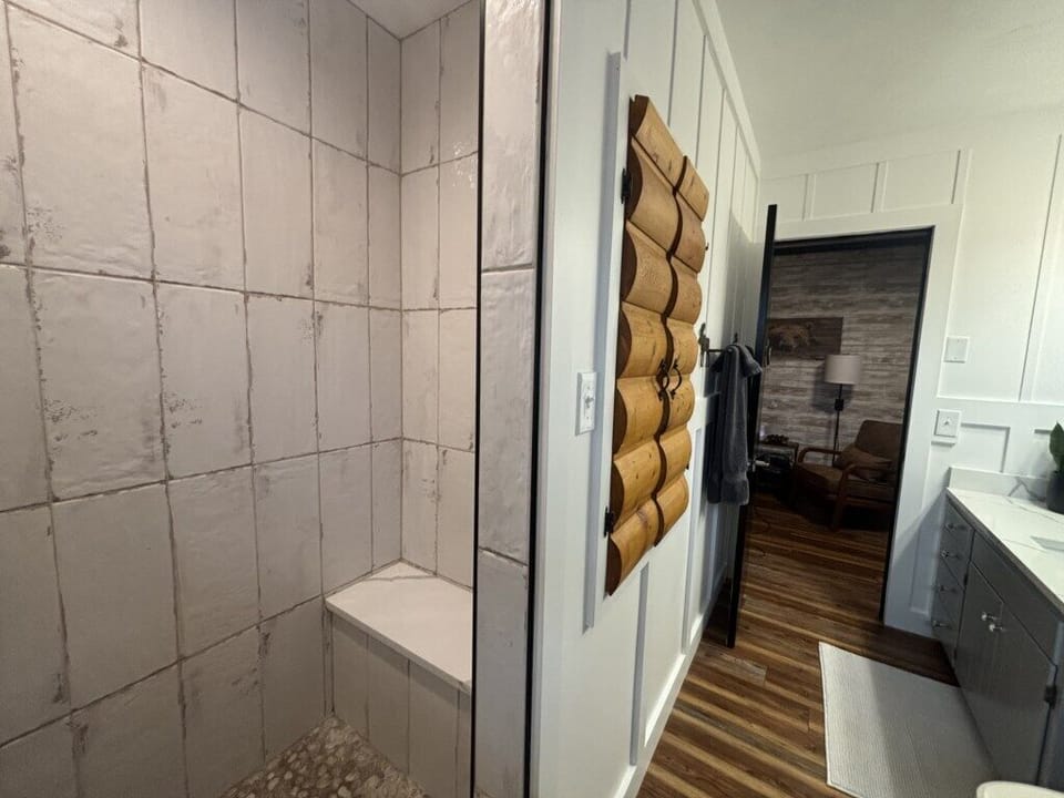 Main level bathroom with walk in shower.jpeg