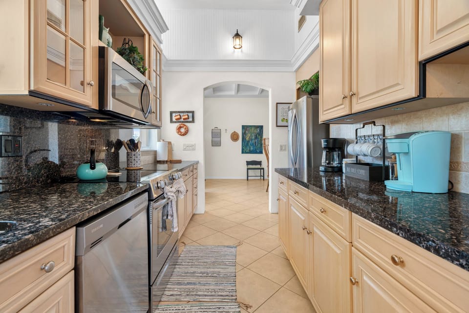 Beautiful, clean appliances and spacious countertops for cooking.