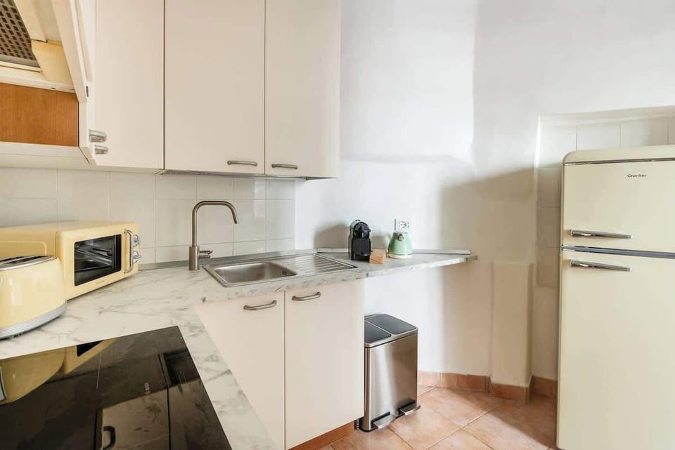 Bright retro kitchen with modern appliances and a coffee station
