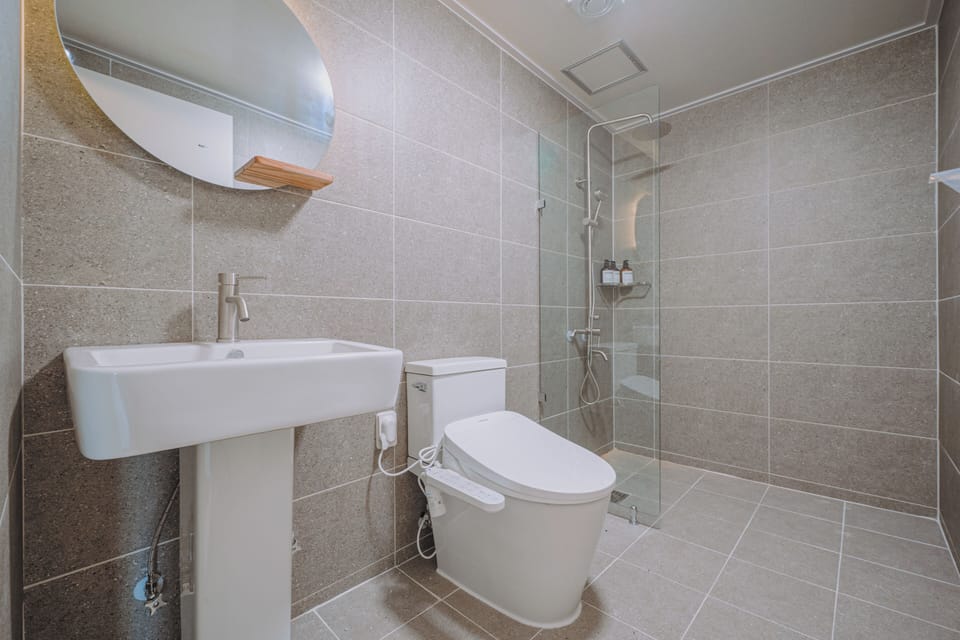 Deluxe Double Room, Balcony, City View | Bathroom | Shower, hair dryer, towels, soap