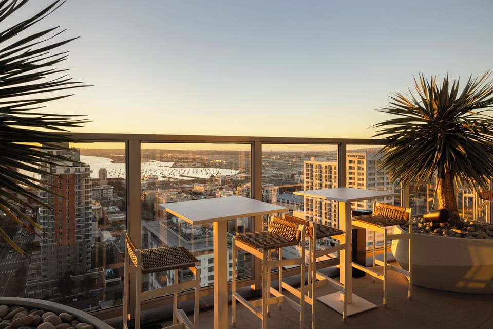 Sip your morning coffee or evening cocktail overlooking the vibrant city and bay.