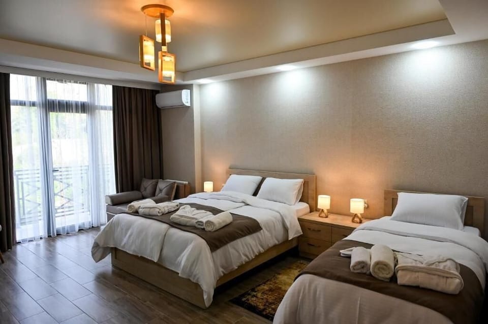 Family Room, Balcony, City View | Desk, iron/ironing board