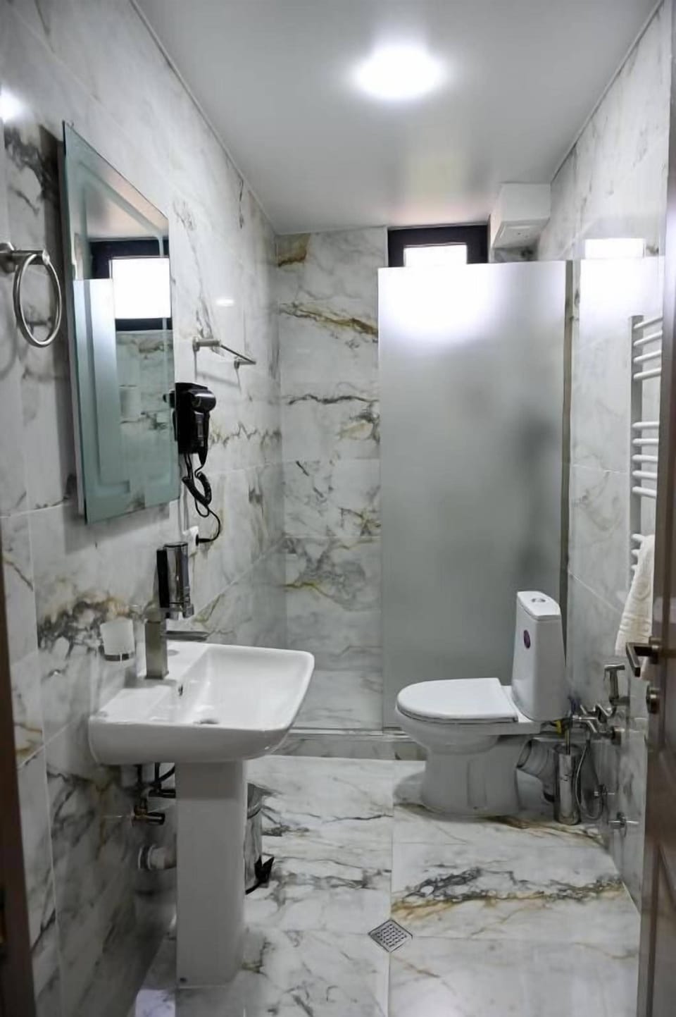 Separate tub and shower, free toiletries, hair dryer, slippers